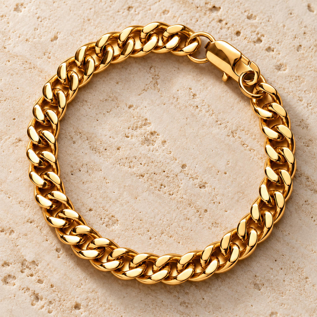The Lil Cuban — Gold-tone detail view on cream stone