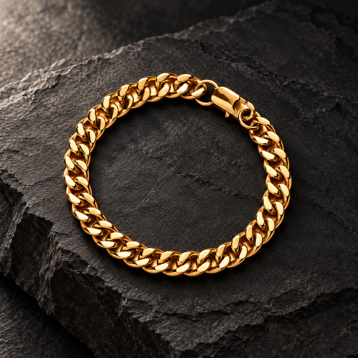 The Lil Cuban — Gold-tone editorial view on charcoal stone