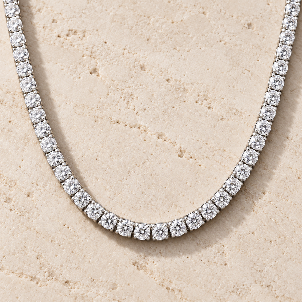 The Tennis Club Necklace — Silver-tone detail view on cream stone