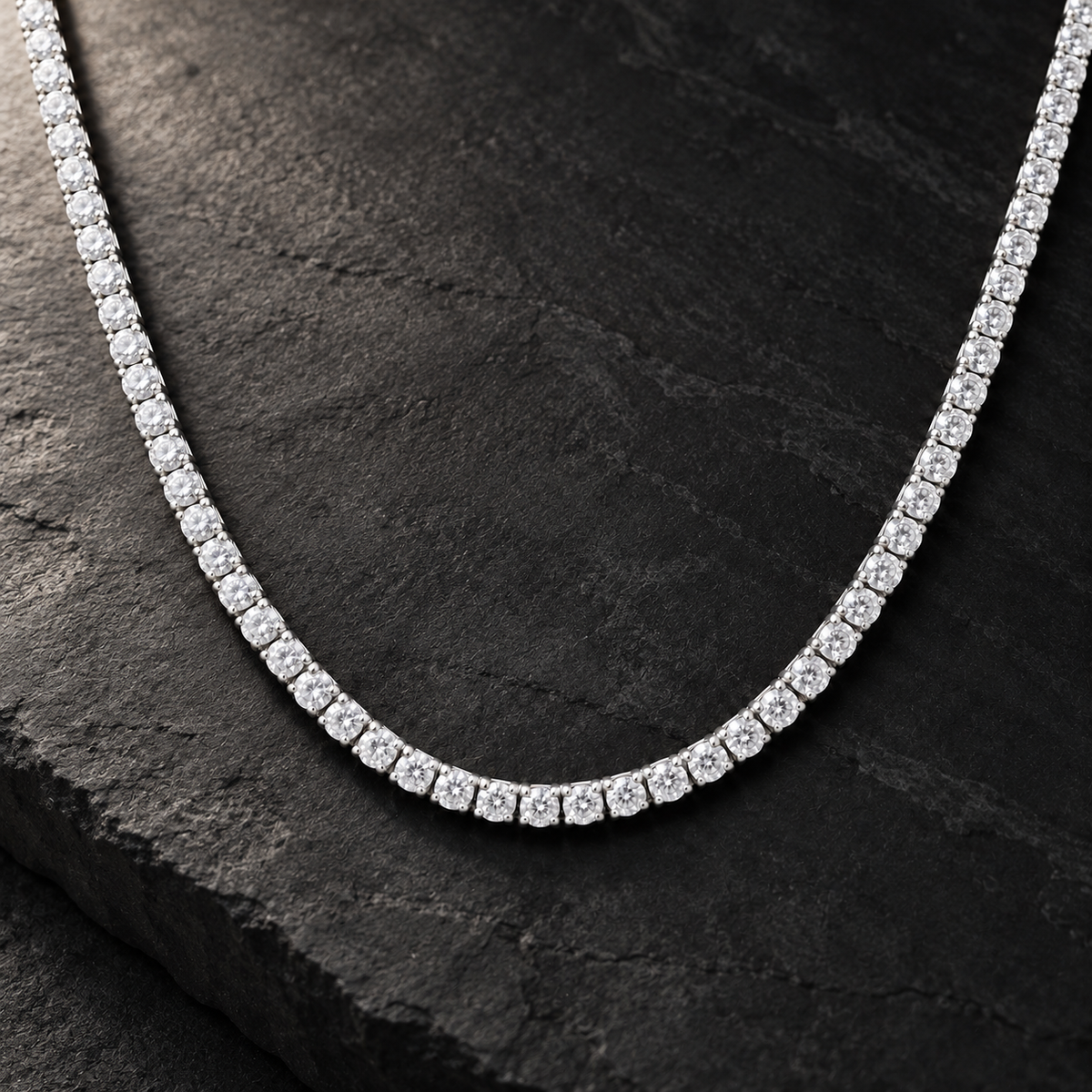 The Tennis Club Necklace — Silver-tone editorial view on charcoal stone