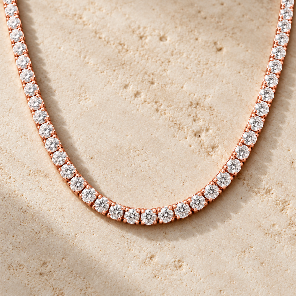 The Tennis Club Necklace — Rose Gold-tone detail view on cream stone