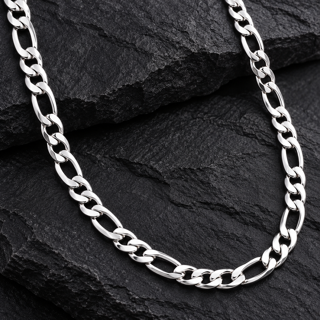 The Figaro Chain — Silver-tone detail view on cream stone