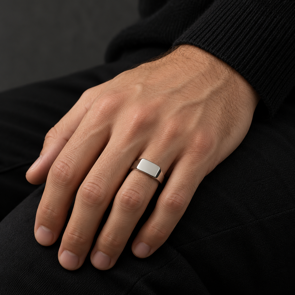 The Frame Signet — Silver-tone worn on a model — AI-generated styling image