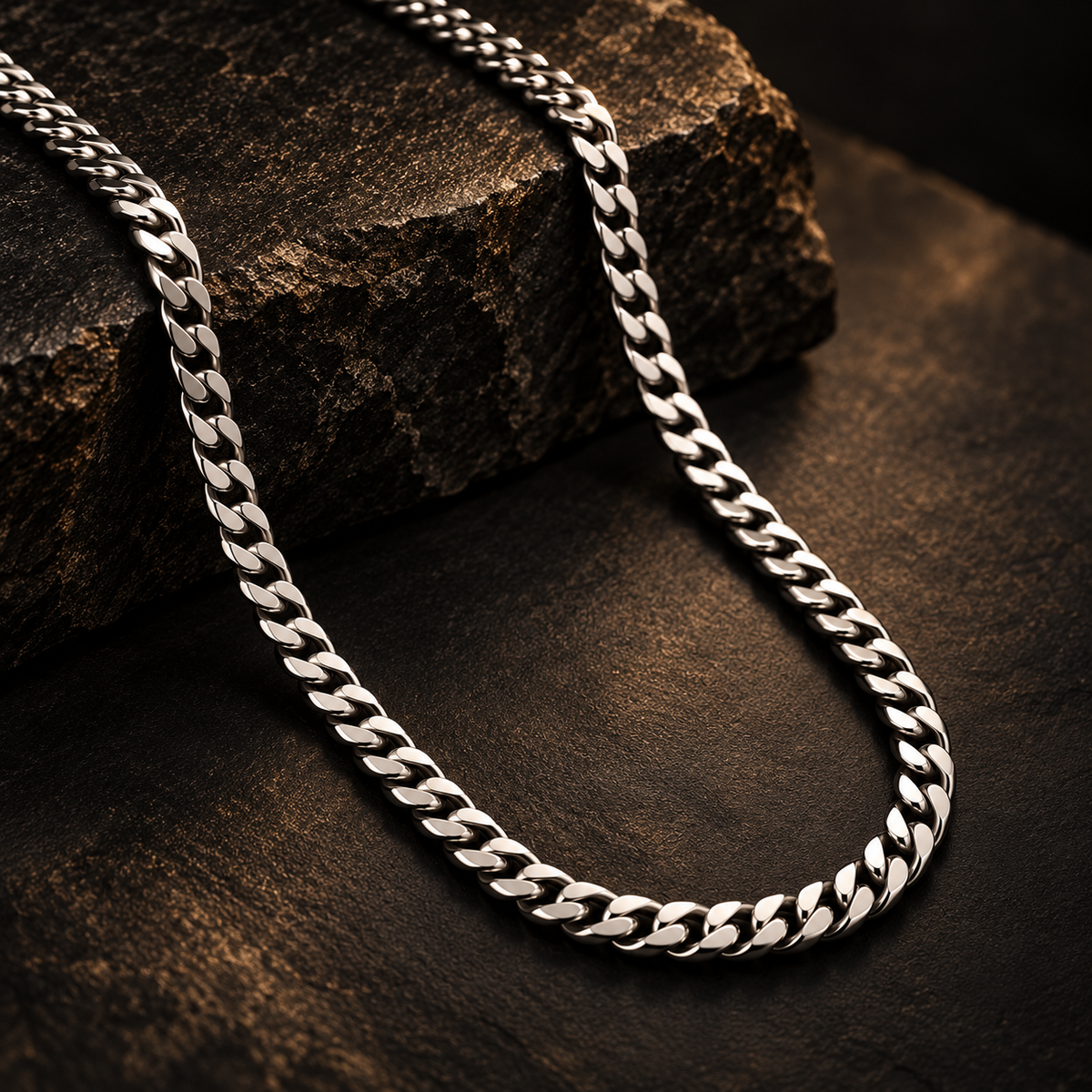 NORTHLINE Classic Curb silver-tone curb chain draped over dark textured stone