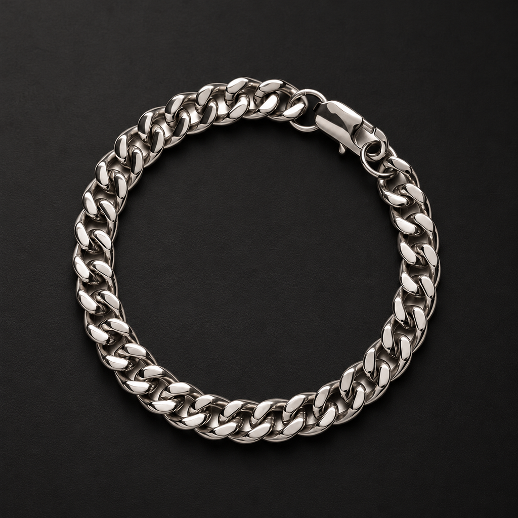 NORTHLINE Lil Cuban silver-tone Cuban-link bracelet with clasp on a dark surface