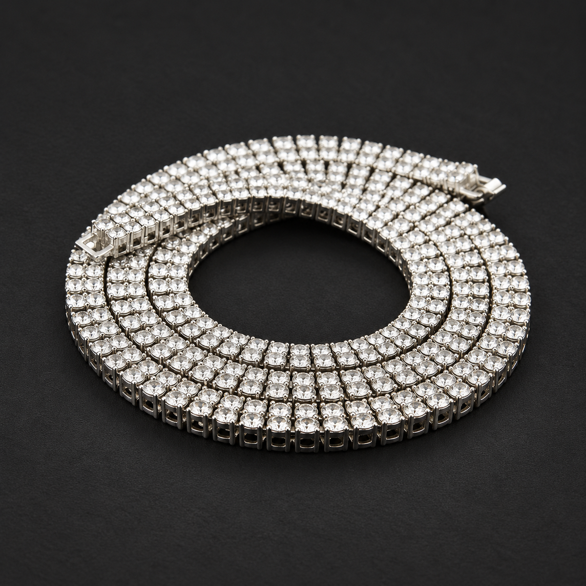 NORTHLINE Double Halo silver-tone stone-set chain coiled on a dark surface